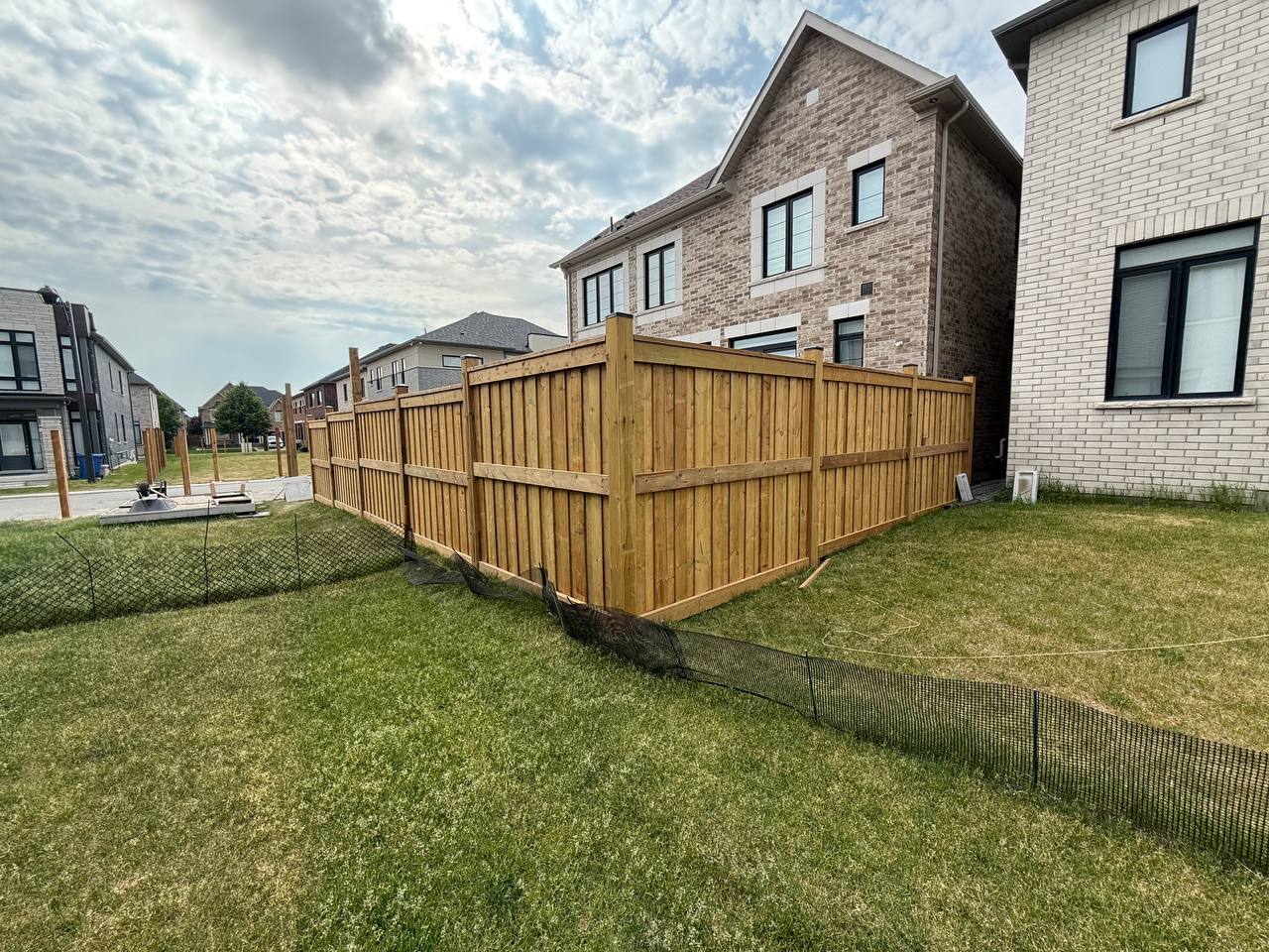 Exterior carpentry for a residential fence and property enclosure
