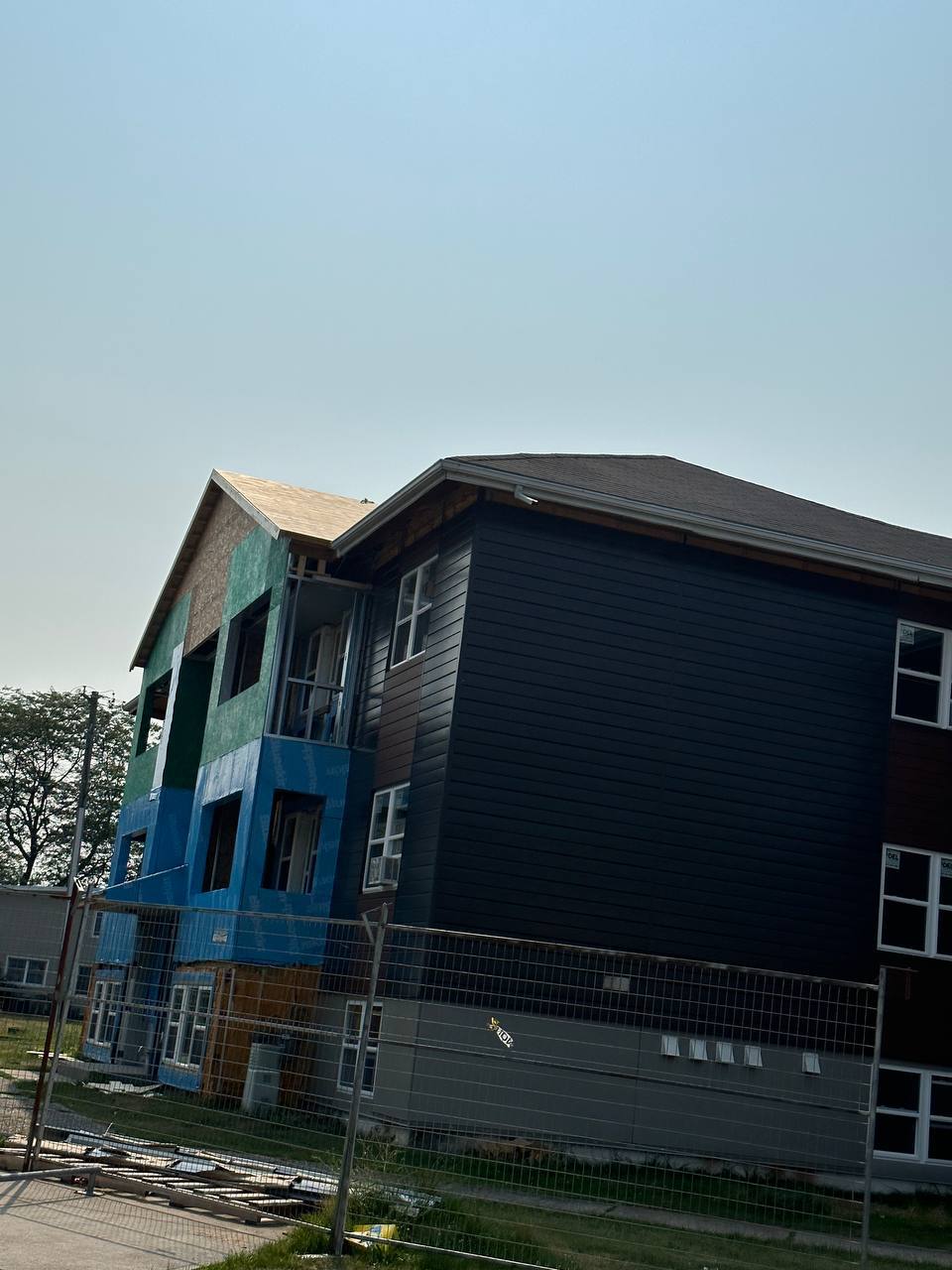 Siding and envelope work on a multi-unit residential building