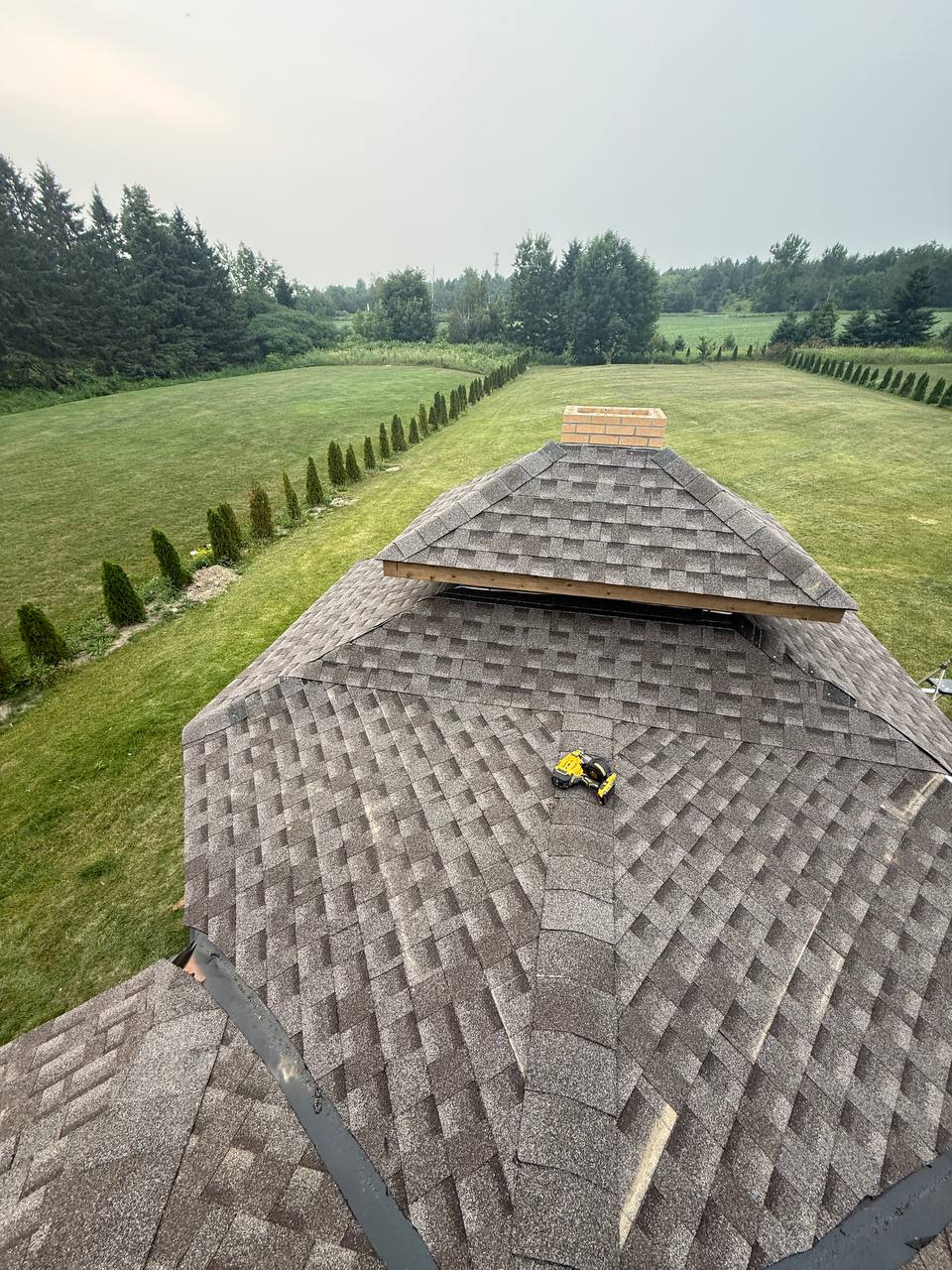 Roofing work on an active construction project