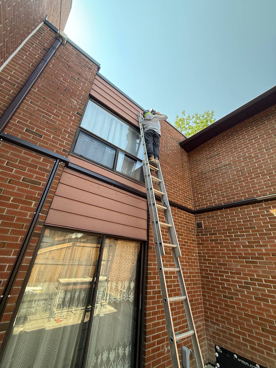 Brick and cladding restoration on a two-storey exterior